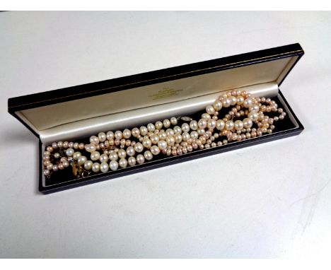 A 9ct gold cultured pearl bracelet, a single-strand cultured pearl necklace with 9ct gold clasp and two costume pearl necklac