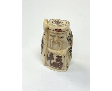 A carved Chinese bone netsuke - Village elder with staff