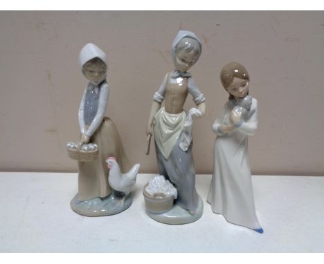 Three Nao figures of a girl with a puppy, girl with chicken and girl with wash tub. (3)