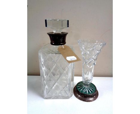 A cut glass whisky decanter with silver collar together with a further cut glass vase on silver base 