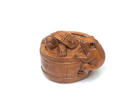 A carved Chinese hardwood netsuke - Turtle and frog in barrel 