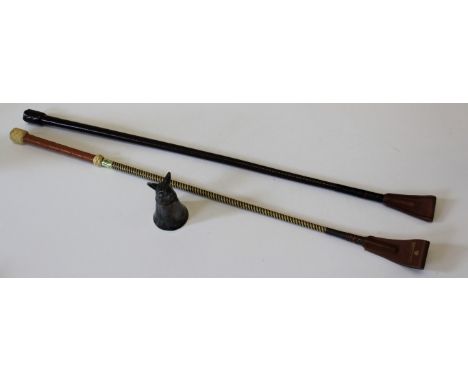 A leather riding crop, the handle set with button named Swaine, Adeney, Brigg, 72cm, a Mountfort riding crop and a white meta