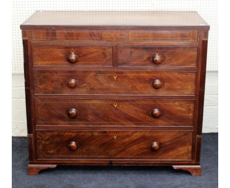 An early 19th century mahogany, boxwood strung chest, the rectangular crossbanded top over two short and three long drawers w