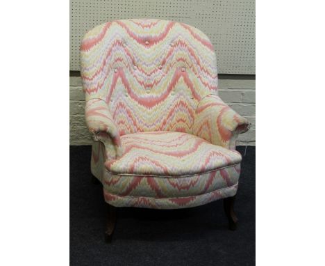 A Victorian style combed pastel button upholstered nursing armchair, raised on cabriole forelegs and knuckle feet