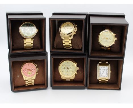 A collection of six boxed Michael kors dress watches. To include chronograph examples and spare links. All quartz movements