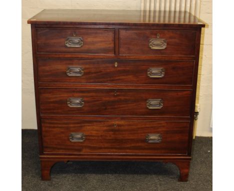 An early 19th century mahogany chest, the boxwood strung rectangular top over two short and three graduated long drawers with
