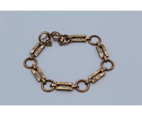 A 9ct rose gold bracelet of alternate hoop and gate links