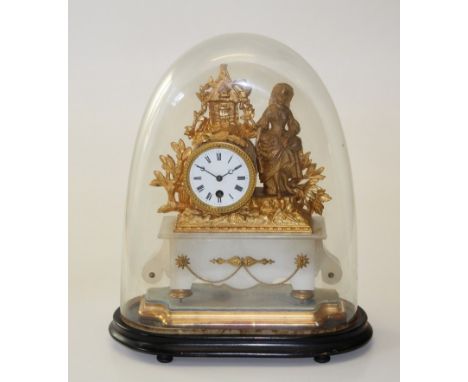 An early 20th century French gilded spelter mantle clock, the figural surmounted drum case enclosing an eight day movement. O