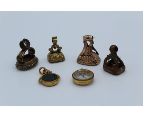 A collection of watch fobs, featuring a rose yellow metal Georgian example, set with a carnelian ( weight&nbsp;approximately 