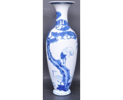 A vintage 20th century Chinese Oriental Blue and White ceramic Crane vase having a flared lip over a waisted neck atop an ovo