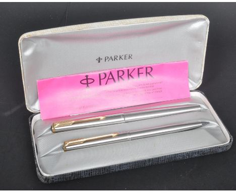 A pair of vintage circa. 1970's Parker pens to include a Parker fountain pen and a mechanical pencil. Both having a chrome co