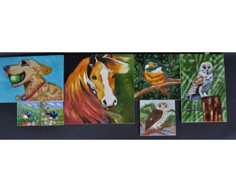 A collection of vintage 20th century tube lined polychrome ceramic tiles of various animals to include an owl, kingfisher, La
