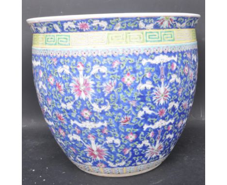 A vintage late 20th century Chinese Oriental ceramic hand painted porcelain planter / jardiniere having a florally detailed e