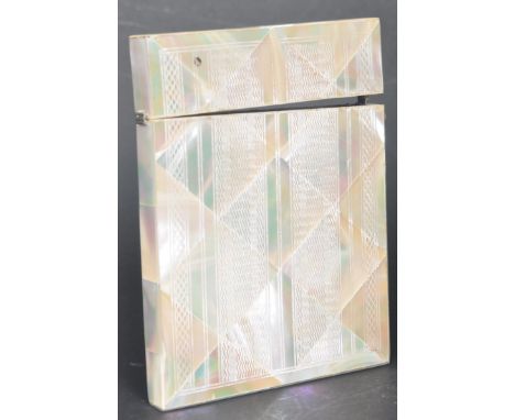 An early 20th century circa. 1900s Edwardian era mother of pearl card case having incised engine turned decoration to the cas