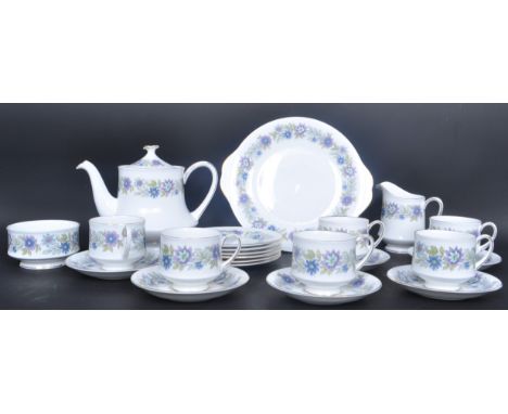 A vintage 20th century Paragon bone china tea service in the 'Cherwell' pattern comprising of teacups, saucers, teapot and ca