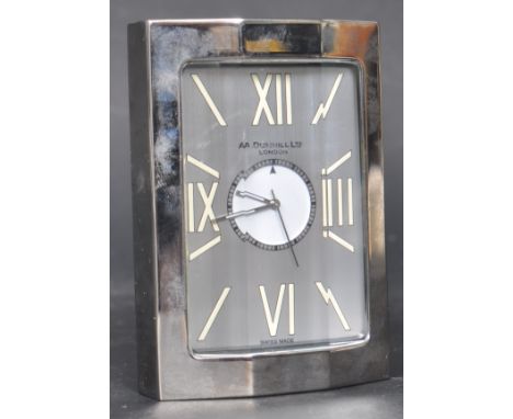 A retro vintage late 20th century space age swiss made A Dunhill Limited of London travel alarm clock having a a panelled gla