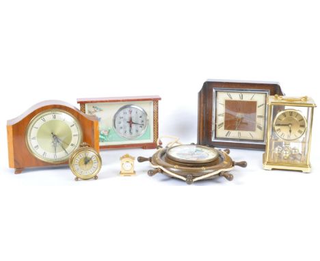 A collection of vintage 20th century clocks to include a brass cased carriage clock with skeleton movement, a walnut cased ma