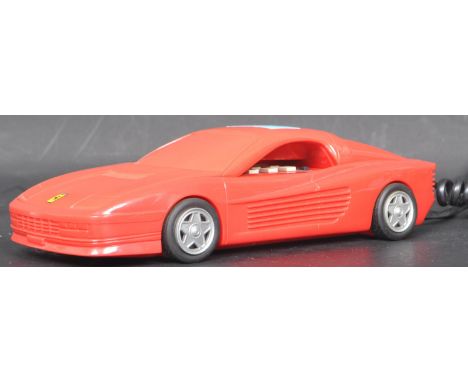 A late 20th century vintage retro Betacom Ferrari car phone telephone in a red colourway. Model No. CP/6. Made in Japan. Meas