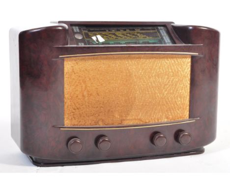 A retro vintage mid 20th Century bakelite cased AM radio receiver. Model Philips 170A.&nbsp; Having a fabric speaker front wi