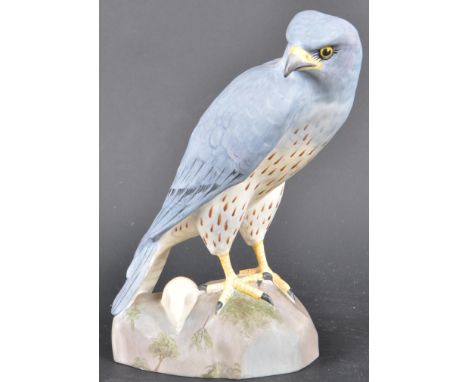 A 20th century Spode ceramic ornament of a male Montagu's Harrier raised on a naturalistic base. (Circus Pygargus). Makers st