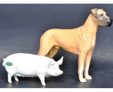 A pair of vintage 20th century Beswick porcelain china figures to include a Beswick Pig Sow marked C.H. Wall Queen 40 with Be