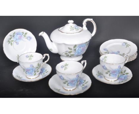 A vintage 20th century Paragon 'Blue Rose' tea service comprising of four teacups, saucers, side plates and a teapot. All hav