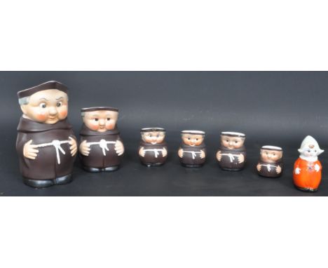 An assortment of vintage 20th century West German Goebel Hummel Friar Tuck monk jugs having hand painted features and marked 