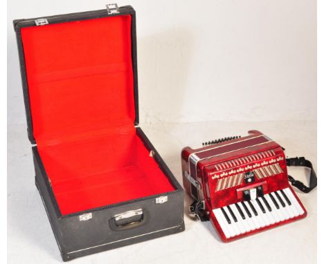 A vintage 20th century chromatic piano accordian 20 key keyboard accordion instrument&nbsp;having 48 bass buttons and a 16 ke