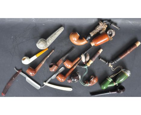 A collection of vintage 20th century smoking pipes comprising of a green ceramic pipe, extra bruyere pipe, Meerschaum example