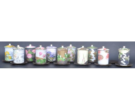 A collection of Japanese Oriental Twelve Flowers of the Celestial Meadow porcelain teacups having vivid polychrome floral dec