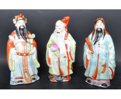 An assortment of three vintage 20th century Chinese ceramic figures in the form of Chinese elders in traditional dress. Measu