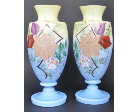 A pair of 19th century Victorian, Napoleonic style, opaline glass vases with floral and geometric decorations. The vases with