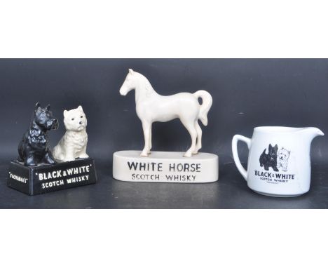 Of Breweriana interest - A collection of vintage 20th century whiskey related ornaments to include a Black &amp; White Whiske