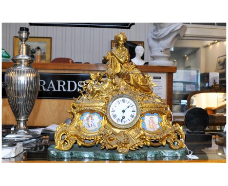 French Gilt Brass Figural Mantle Clock. Central Dial Between two Sevres Style Plaques. Raised on a Green Marble Base. 