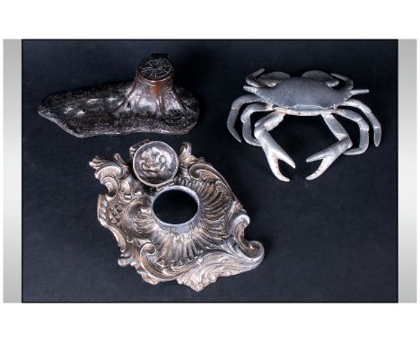Three Metal Inkwells, one in the rococo style, marked to base, Modele Depose, tree trunk form, alloy crab marked Italy 1946.