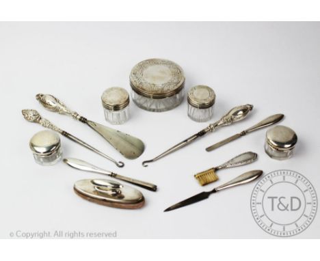 A selection of silver mounted dressing table items to include a  Victorian set of three jars, Ann Reid, London 1847, 8cm diam