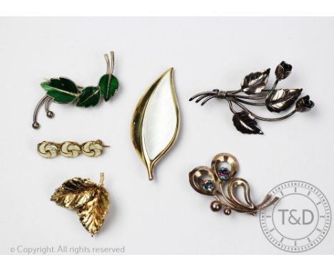 A collection of six brooches to include; a Flora Danika gold plated sterling silver leaf brooch, circa 1950's/60s, a Herman S