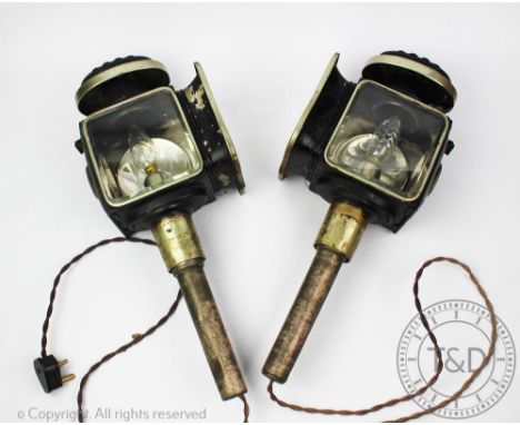 A pair of 19th century coaching lamps, with shield shaped bevelled glass panels, 48cm high (2) Provenance: Clynog Farmhouse, 