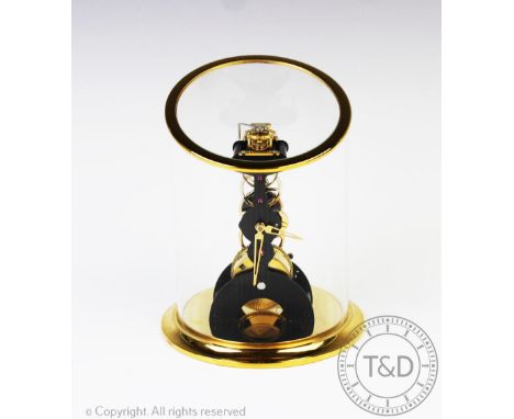 A Swiss L'Epee la Tour time piece, with eight day skeleton movement, on a gilt circular base and under an angled gilt metal a