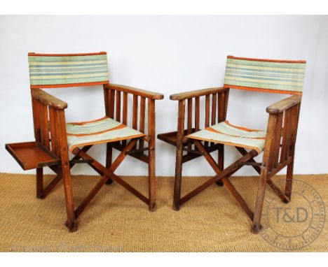 A pair of 1950's vintage folding chairs, with striped seat and back and folding side tray (2) CONDITION REPORT: All four canv