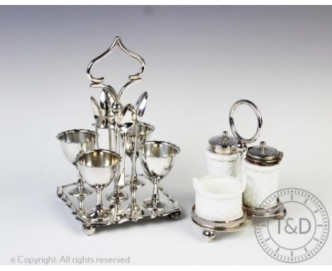 A James Dixon &amp; Sons silver plated egg cruet stand, raised on an ogee moulded base supporting four egg cups and four spoo