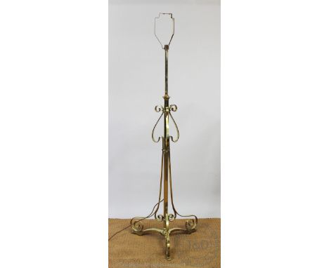 An early 20th century telescopic brass standard lamp, with scroll detailing, 135cm CONDITION REPORT: Lighting lots are sold a