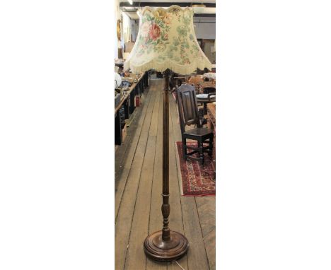 An Edwardian stained beech standard lamp, with fluted column on circular base, 162cm H Provenance: Clynog Farmhouse, North Wa