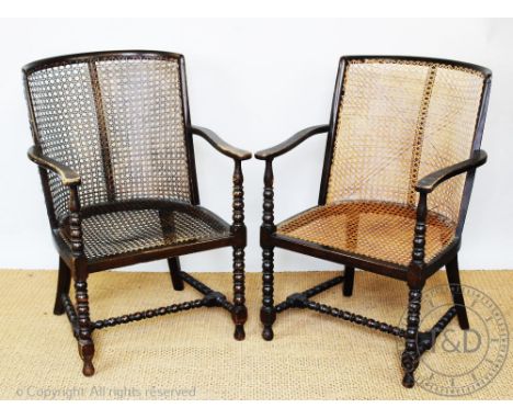 A pair of 1920's stained beech tub chairs, with canved backs and seats, on bobbin turned legs, 89cm H (2)