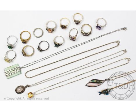 A selection of jewellery, to include; an amethyst ring stamped '9ct', an assortment of silver rings, an articulated fish pend