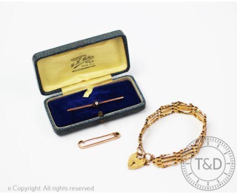 A 9ct gold gate bracelet, designed as articulated panels with an attached padlock clasp, gross weight 9.6gms along with a dia