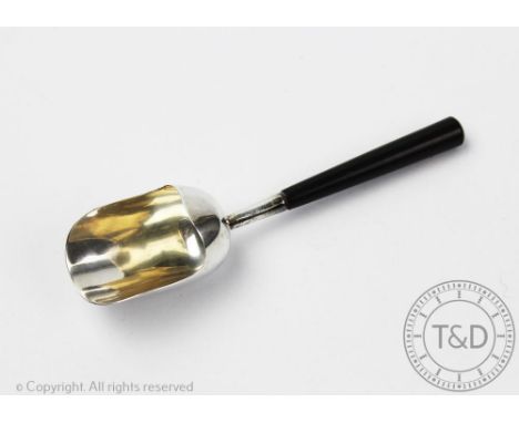 An Edwardian silver caddy shovel, Birmingham 1909, of large proportions with tapered ebonised handle, 14cm long