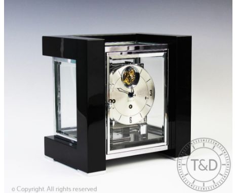 A modern Art Deco style Kieninger chiming mantel clock, the silvered Arabic numeral dial with radial detailing, with an eight