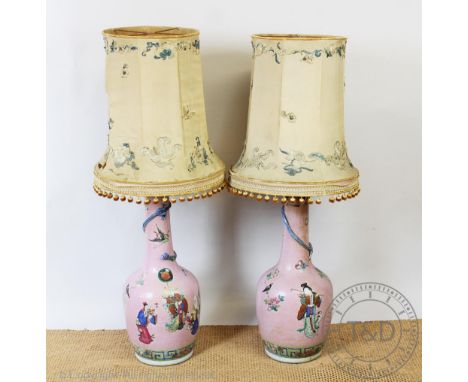 A pair of Chinese famille rose vases, 19th century, each applied with a dragon and decorated with sages, figures, insects and
