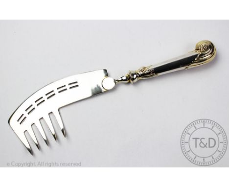 A George V silver gilt combintation fish slice/fork, William Hutton &amp; Sons Ltd, Sheffield 1917, pistol grip handle, 27.5c